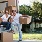 Young couple with moving van