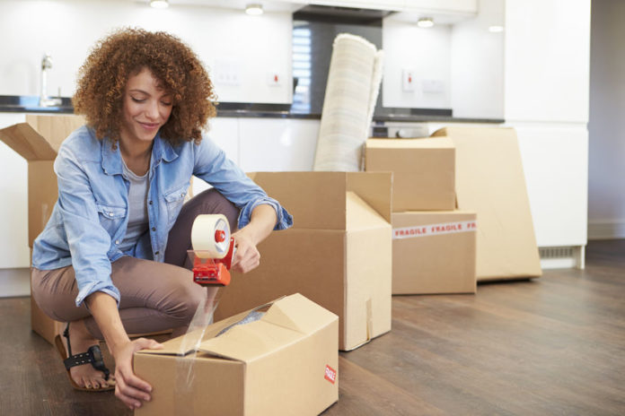 Woman Packing Boxes for Self Storage Unit