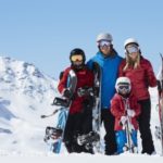 42401975 – family on ski holiday in mountains